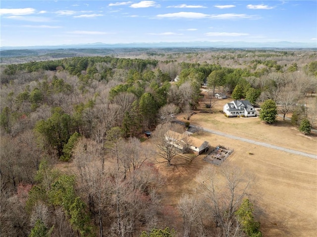 birds eye view of property with a rural view and a view of trees