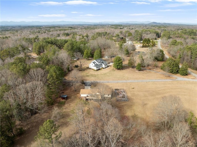 birds eye view of property with a rural view and a forest view