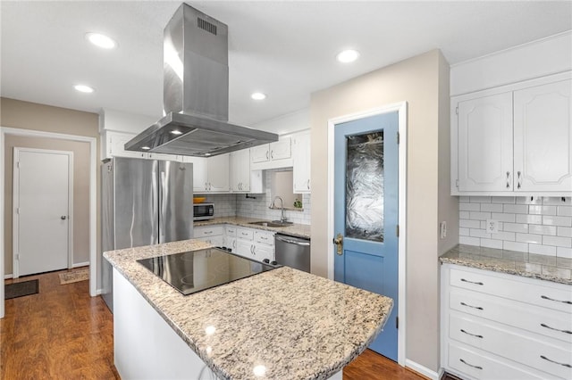 kitchen featuring dark wood finished floors, white cabinets, appliances with stainless steel finishes, and island exhaust hood