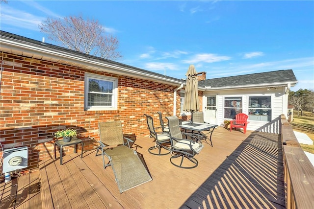 wooden deck featuring outdoor dining space