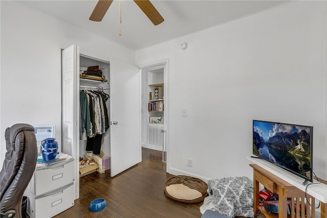 bedroom with wood finished floors, a closet, and ceiling fan