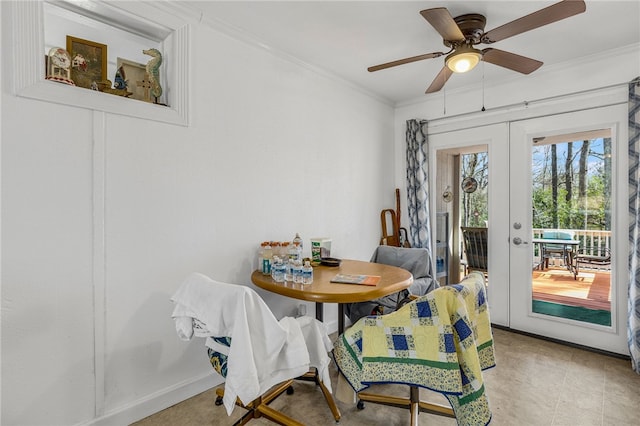 dining space with a ceiling fan, crown molding, french doors, and baseboards