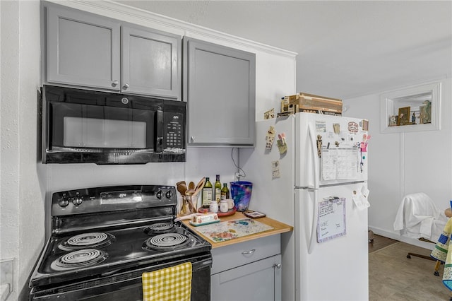 kitchen with black appliances, light countertops, and gray cabinets