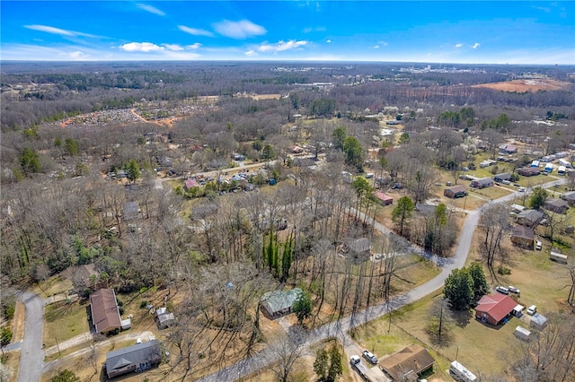 drone / aerial view featuring a view of trees