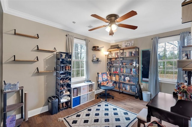 office area with plenty of natural light, crown molding, baseboards, and wood finished floors