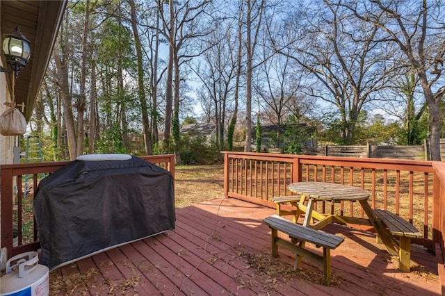 wooden terrace featuring area for grilling