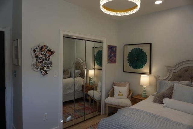 bedroom featuring recessed lighting and a closet