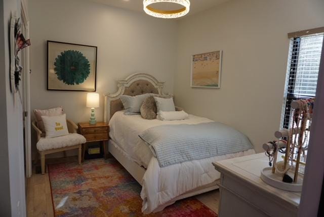 bedroom with light wood finished floors