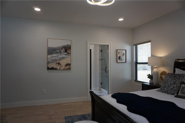 bedroom featuring light wood finished floors, recessed lighting, connected bathroom, and baseboards