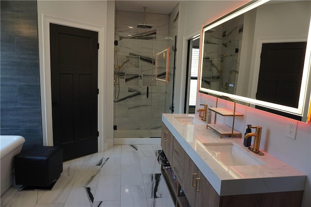 bathroom with a shower stall, double vanity, marble finish floor, and a sink