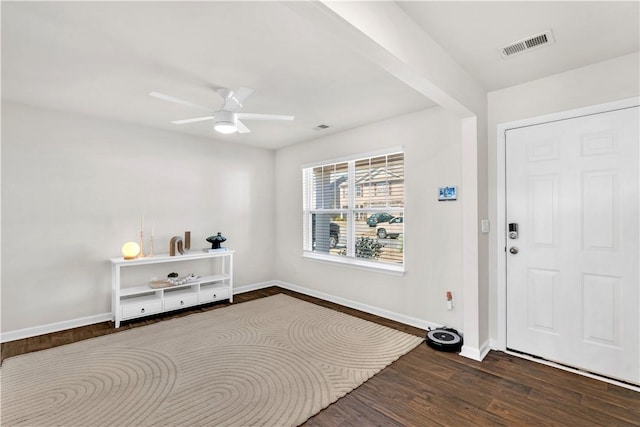 entryway with ceiling fan, visible vents, baseboards, and wood finished floors