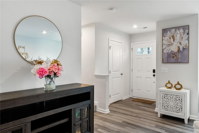 entrance foyer with recessed lighting, baseboards, and light wood-type flooring