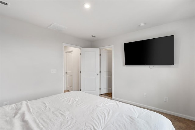 carpeted bedroom with recessed lighting, baseboards, and visible vents