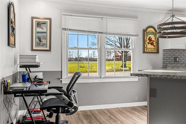 office area with baseboards and wood finished floors