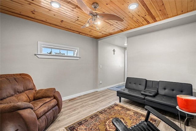 living area with light wood finished floors, visible vents, ceiling fan, baseboards, and wooden ceiling