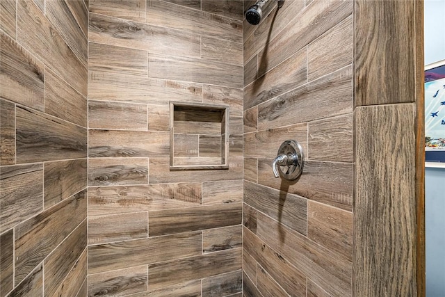 bathroom with a tile shower