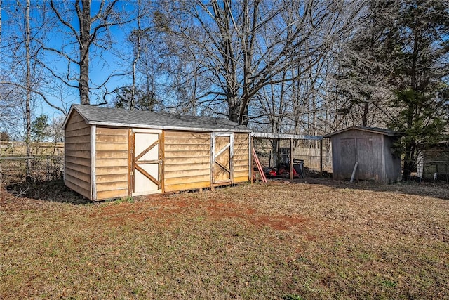 view of shed featuring fence