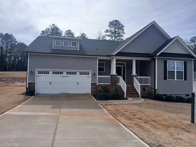 craftsman-style house with covered porch, concrete driveway, an attached garage, and a shingled roof