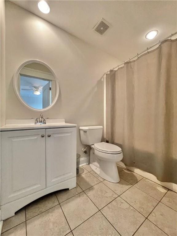 full bathroom with tile patterned floors, visible vents, toilet, a shower with shower curtain, and vanity