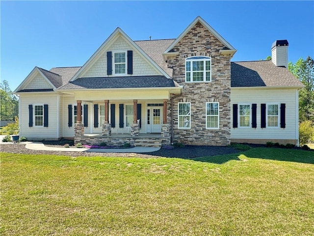 106 Johnathon Ln, Easley, SC 29640 - view of front of home with a porch, a front yard, stone siding, a chimney, and a shingled roof