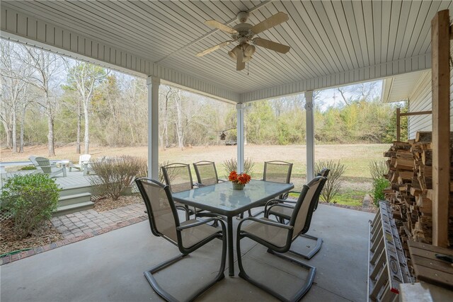 view of patio featuring outdoor dining space and ceiling fan