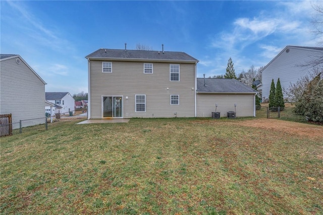 back of property featuring a patio, a yard, a fenced backyard, and central AC