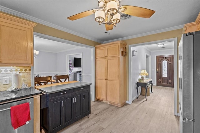 kitchen with crown molding, light wood-style flooring, backsplash, and stainless steel appliances