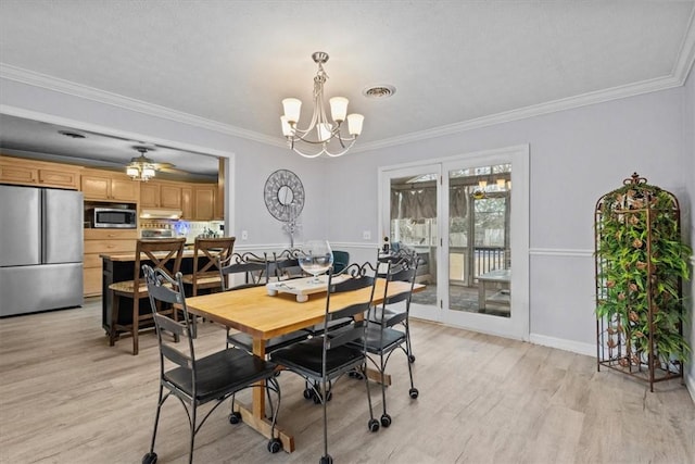 dining area featuring ornamental molding, visible vents, and light wood-type flooring