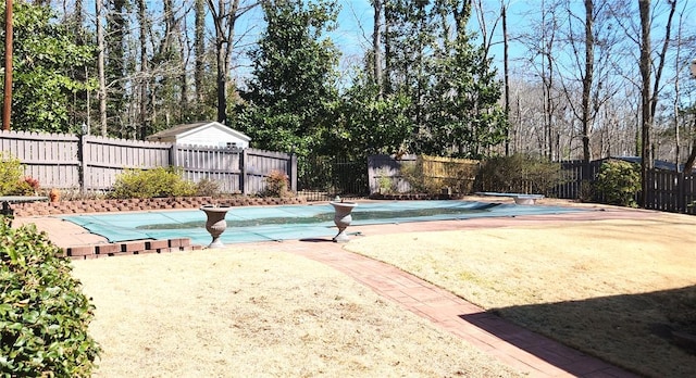 view of pool featuring a diving board, a fenced in pool, and fence