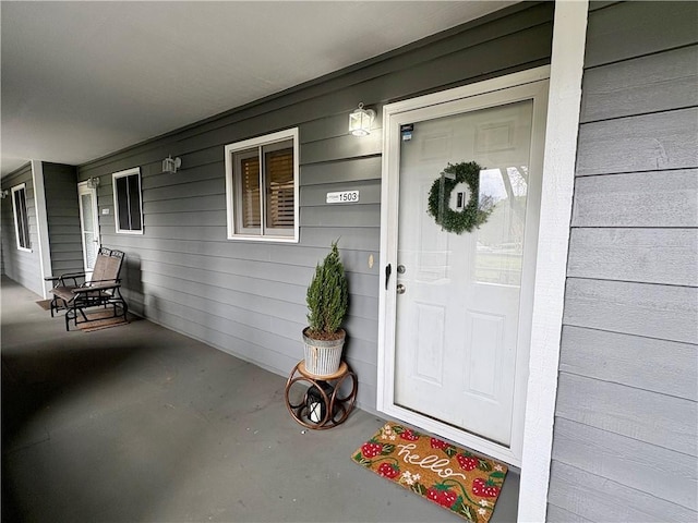 doorway to property featuring a porch