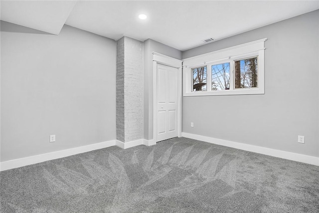 unfurnished bedroom with a closet, baseboards, visible vents, and carpet floors