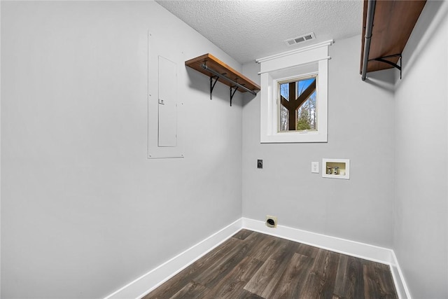 clothes washing area featuring dark wood-style floors, baseboards, laundry area, electric dryer hookup, and washer hookup