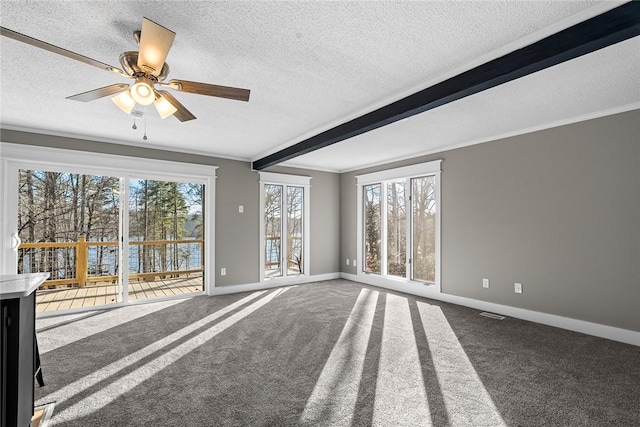 unfurnished living room featuring carpet, baseboards, and ornamental molding