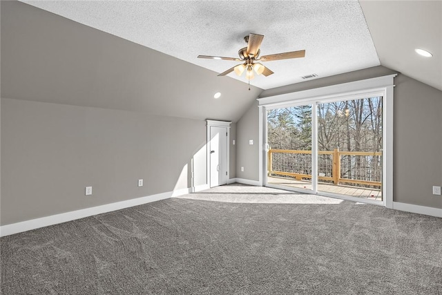 bonus room with visible vents, baseboards, a textured ceiling, and carpet flooring