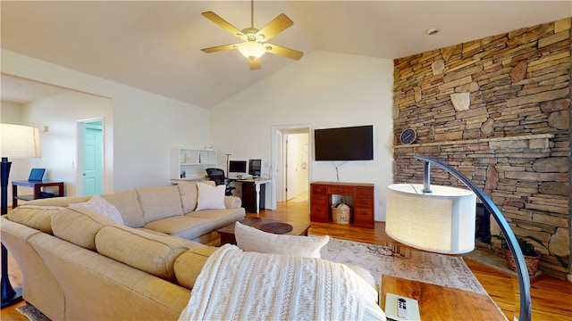 living area featuring high vaulted ceiling, wood finished floors, and ceiling fan