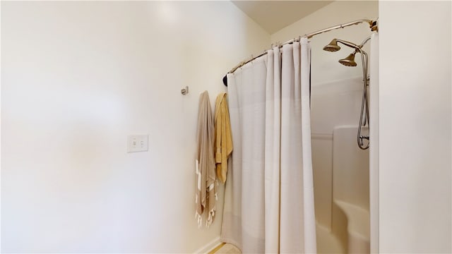 bathroom with a shower with shower curtain