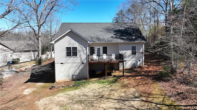 back of house featuring a deck, roof with shingles, and crawl space