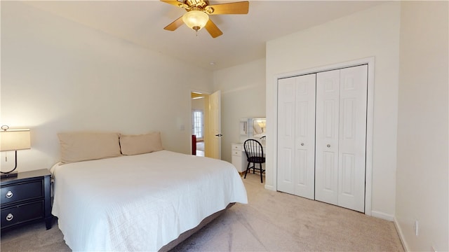 bedroom with ceiling fan, baseboards, a closet, and light carpet