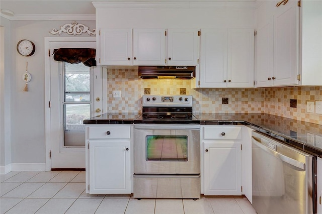 kitchen featuring ornamental molding, decorative backsplash, stainless steel appliances, under cabinet range hood, and white cabinetry