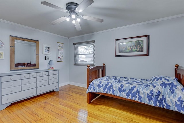 bedroom with crown molding and light wood finished floors