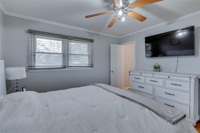 bedroom featuring a ceiling fan and ornamental molding