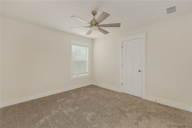 unfurnished room featuring visible vents, baseboards, ceiling fan, and carpet flooring