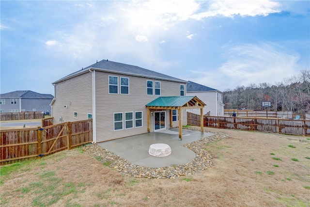 back of house with a patio and a fenced backyard