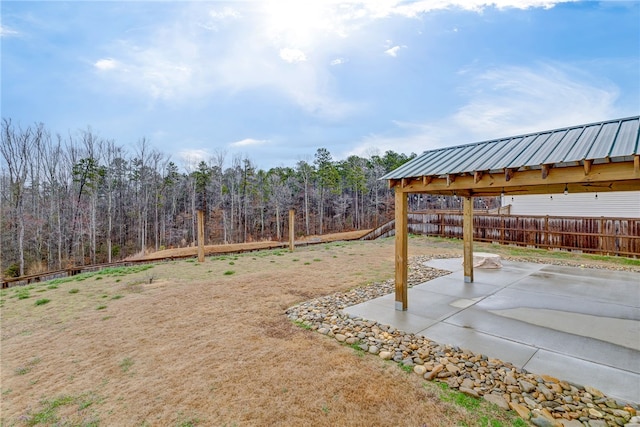 view of yard featuring fence and a patio area