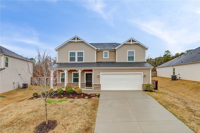 craftsman-style home with cooling unit, driveway, a porch, an attached garage, and stone siding