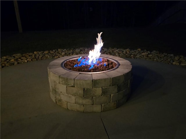 patio at night with an outdoor fire pit