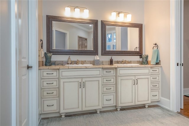 bathroom featuring double vanity and a sink