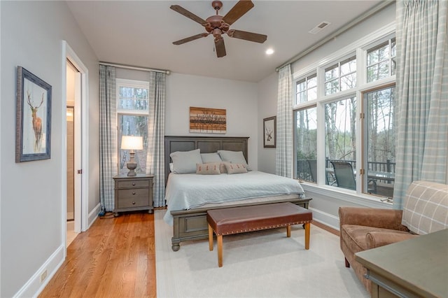 bedroom with light wood-type flooring, visible vents, a ceiling fan, recessed lighting, and baseboards