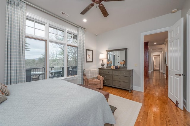 bedroom featuring visible vents, a ceiling fan, wood finished floors, recessed lighting, and baseboards