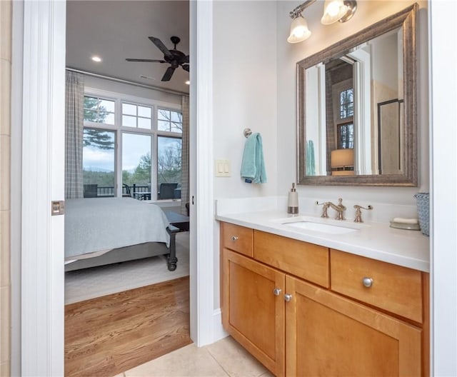 bathroom with vanity, ensuite bath, tile patterned floors, and ceiling fan